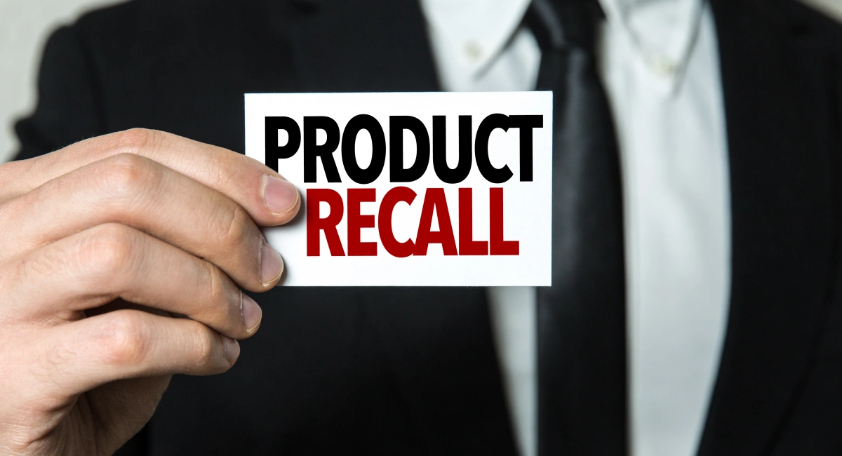 Man holding product recall card