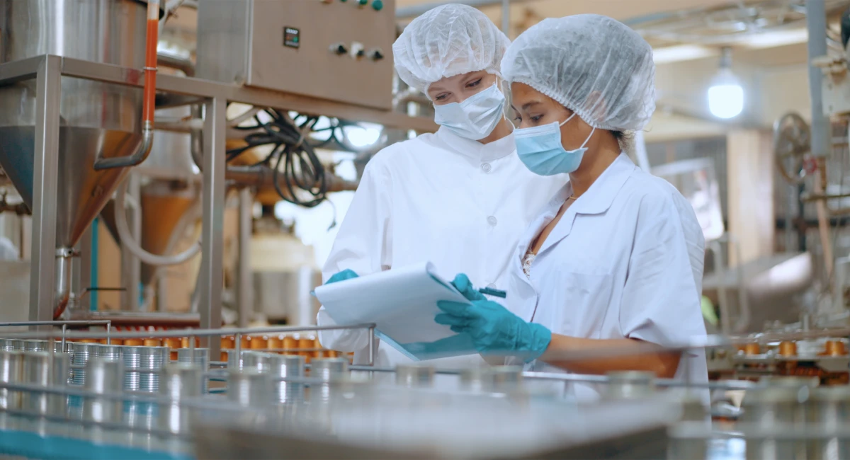 A quality control officer inspecting a production line