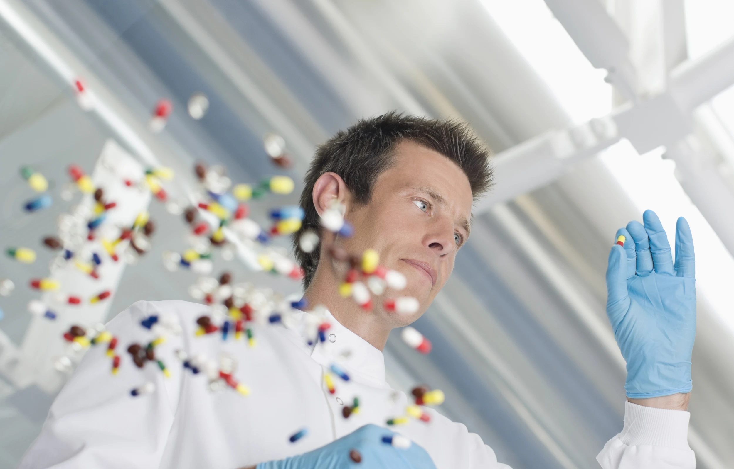 scientist examining pills in lab