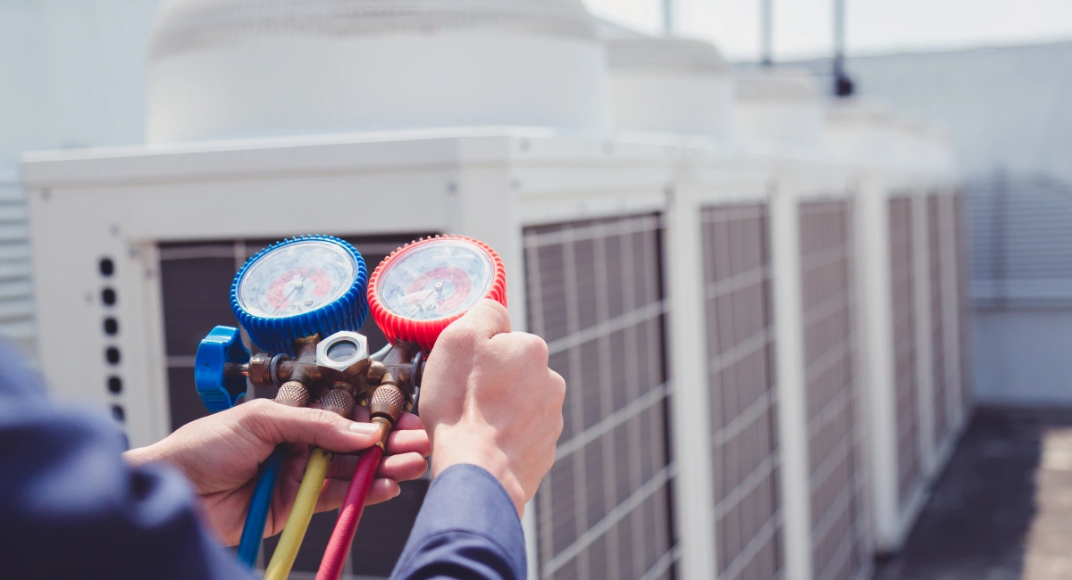 A technician checking an HVAC system