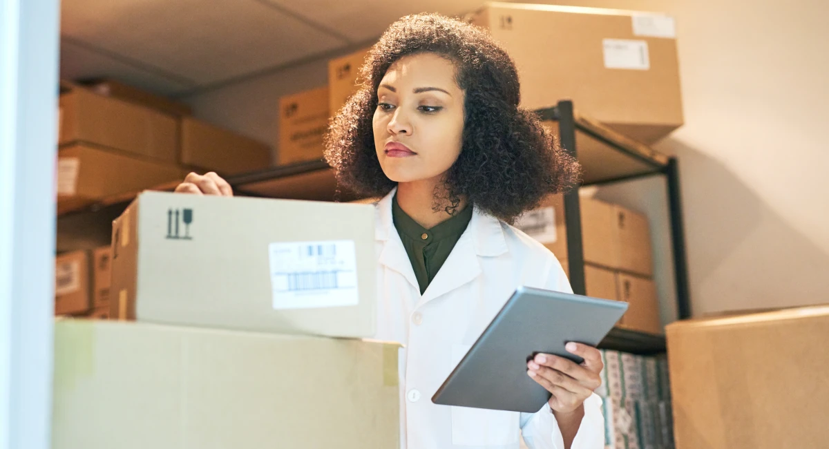 A woman checking inventory in a storeroom