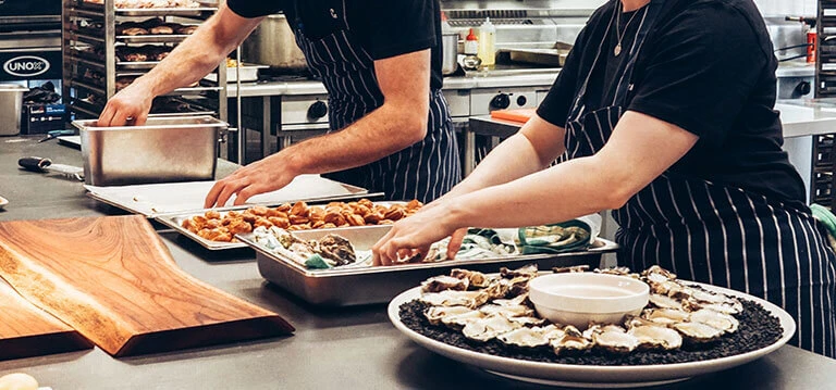Kitchen prepping food before service